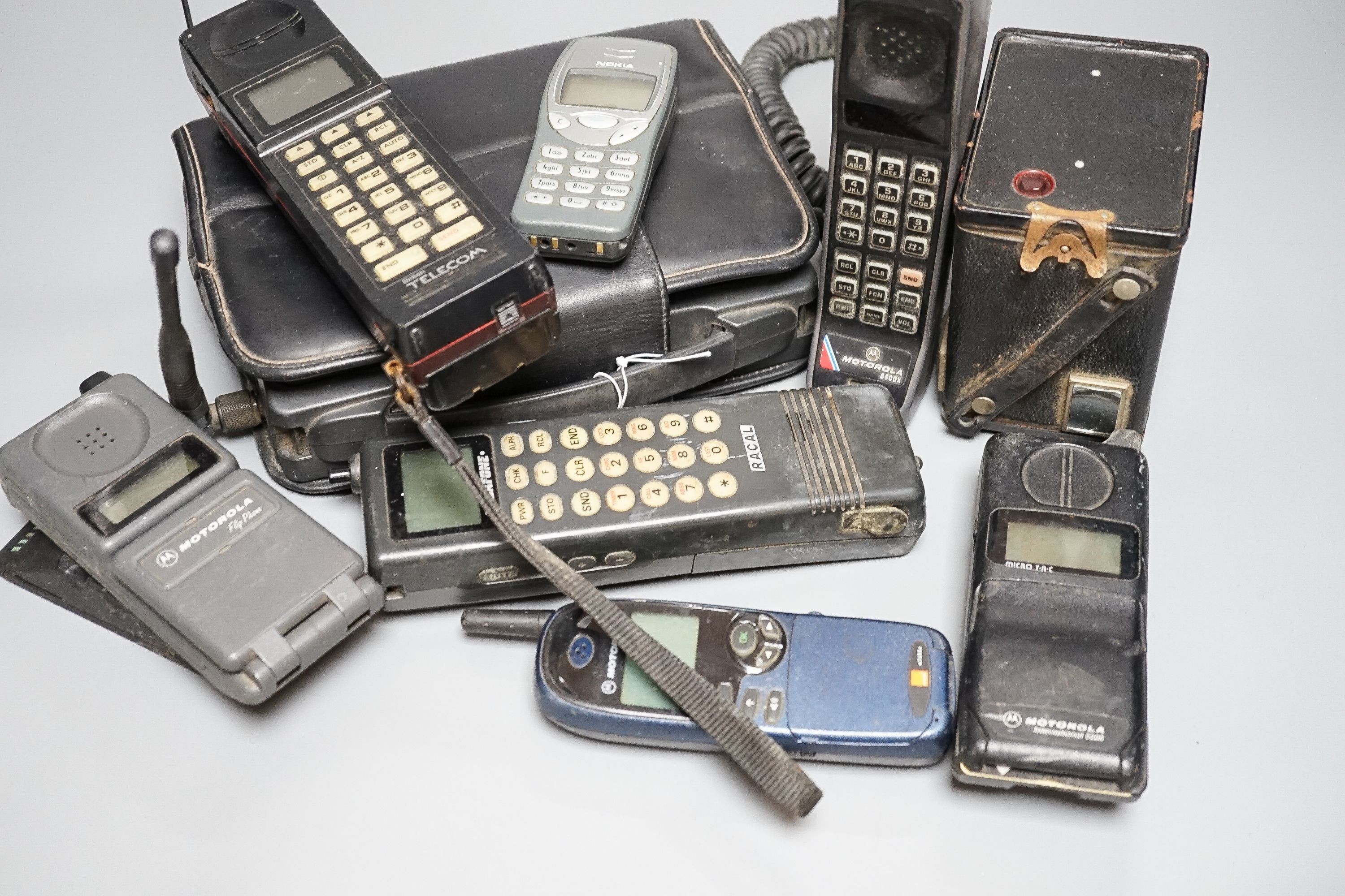 Eight early/retro mobile phones and a Box Brownie